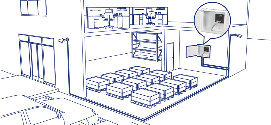 A blueprint-style illustration depicts a two-story building with a warehouse on the ground floor and an office area on the upper floor. The warehouse contains multiple storage units arranged in rows, while the office area has desks and chairs. A close-up inset shows a detailed view of a security or control panel mounted on a wall. The building exterior includes security cameras and large windows.