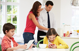 The illustration shows a boy on the left holding and looking at a tablet, a woman and a man in the middle using and looking at a laptop, and a girl on the right holding and looking at a smartphone.