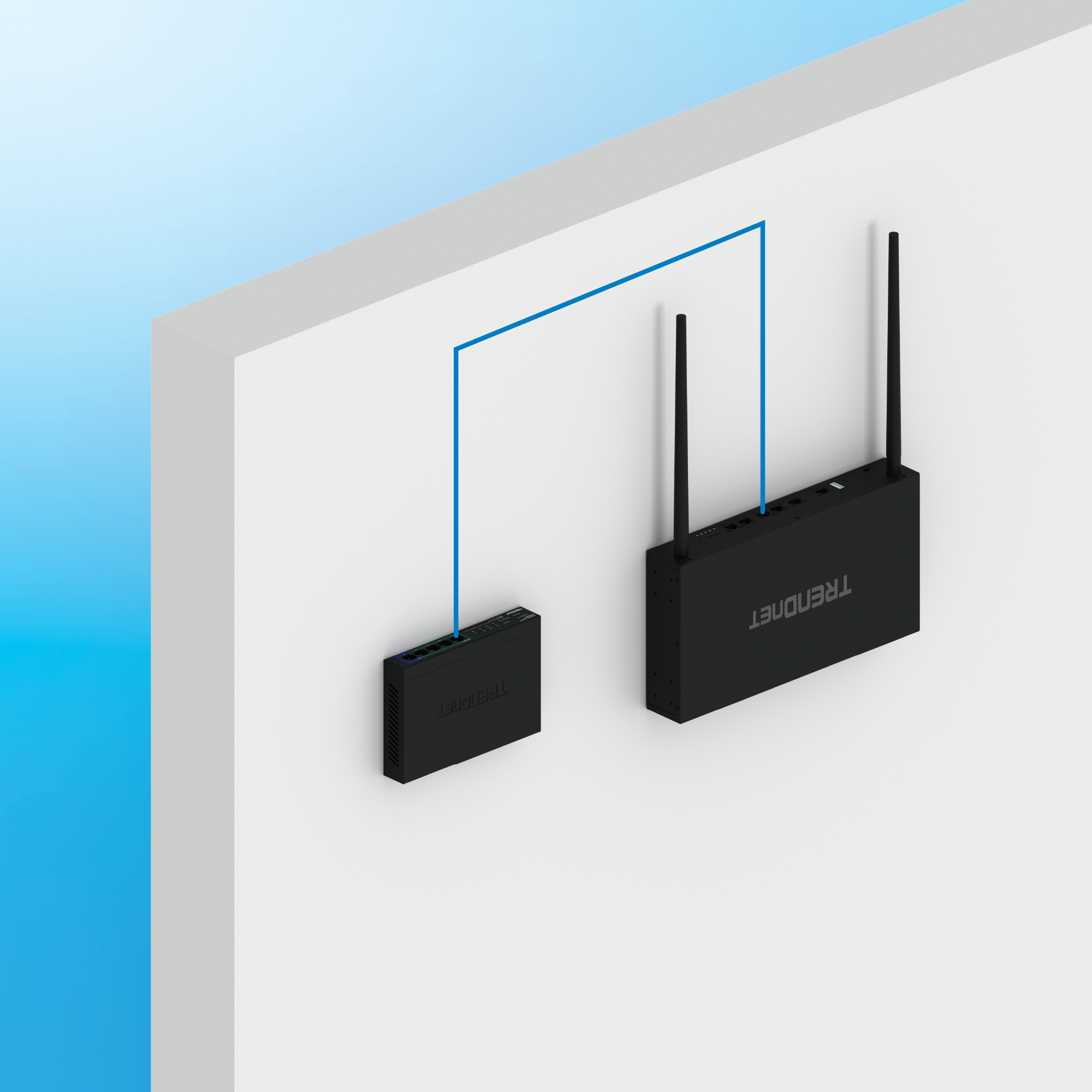 Two TRENDnet networking devices mounted on a wall and connected by an Ethernet cable, illustrating wall-mount installation and network connectivity between devices.