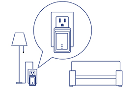 Line drawing of a room with a floor lamp, couch, and an electrical outlet with a Powerline Nano Adapter plugged in. The outlet is highlighted in a speech bubble, indicating smart home technology.